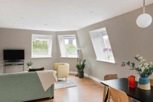 a living room with a couch and a table at Cove Minshull Street in Manchester +16 photos