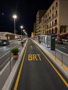 an empty street with a brt sign on the road at Beb al porto da joseph in Trapani +3 photos