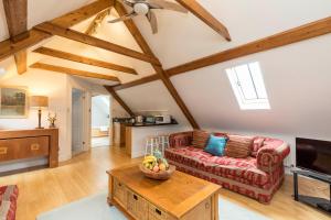 a living room with a couch and a table at Westerlands Farm in Graffham