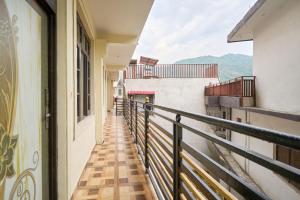 a balcony with a view of a building at Itsy Hotels Twilight in Dalhousie