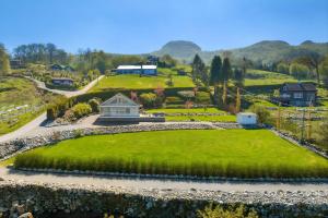 a house on a hill with a green lawn at The Green Bay in Sandnes