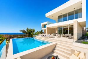 an image of a house with a swimming pool at CHALET 95, Lujo y Piscina Infinity in Adeje