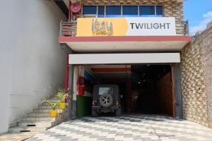 a garage with a car parked inside of it at Itsy Hotels Twilight in Dalhousie