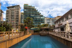 a bridge over a river with a tall building at Victory Suites in Gibraltar