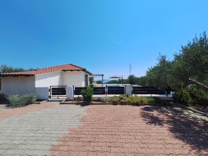 a brick driveway in front of a house at Relax in Orebić +3 photos