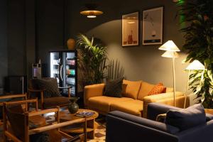 a living room with a couch and chairs at Cove Minshull Street in Manchester