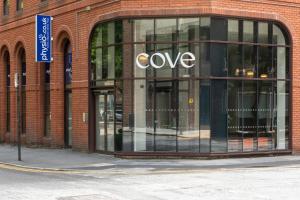 a large store window with the word cove on it at Cove Minshull Street in Manchester