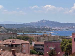 a view of a city with buildings and the water at Guest House Villabianca in La Maddalena