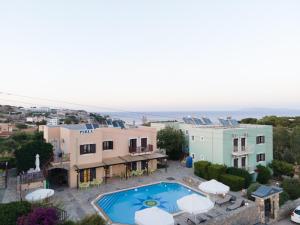 an aerial view of a house with a swimming pool at Perla Apartments in Agia Pelagia