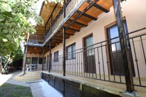 an exterior view of a building with a balcony at Vila Flora Costinesti in Costinesti