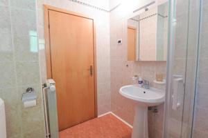 a bathroom with a sink and a toilet and a shower at Apartma pod Rožem in Soča +48 photos