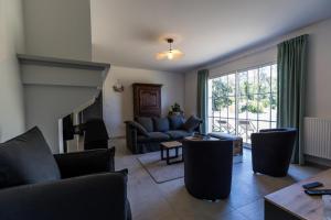 a living room with a couch and a table at Gîte du mouta in Saint-Justin