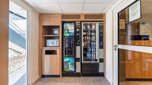 a drink vending machine in a building at Premiere Classe Orleans Nord - Saran in Saran
