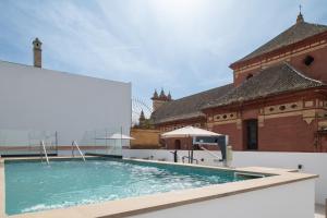 a large swimming pool on the roof of a building at Líbere Seville Triana in Seville