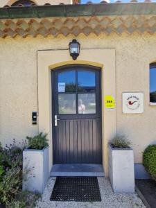 a door of a house with a sign on it at Casa René in Aalter