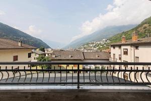a view of a town from a balcony with buildings at Terrazza Valtellina in Grosio