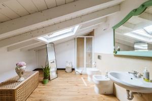a bathroom with a sink and a mirror at Casa Rucola in Sestri Levante +27 photos