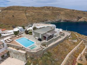 an aerial view of a house with a swimming pool at Nalo Suites & Villas in Kithnos