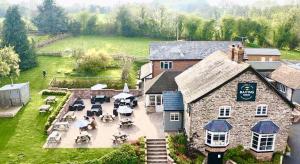 an aerial view of a building with tables and chairs at The Baiting House in Upper Sapey