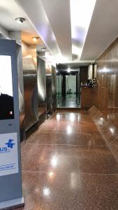 a hallway in a building with a sign on the floor at Estudio Residencias in Buenos Aires