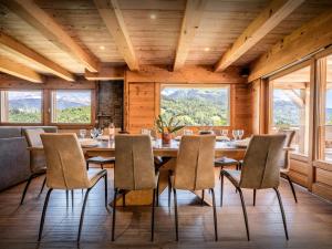 a dining room with a table and chairs at Lodge La Source - OVO Network in Les Clefs