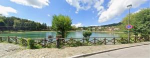 a view of a river with a fence next to it at Casa di nonna Caterina in Nemoli