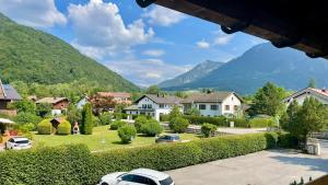 a village with houses and mountains in the background at Haus Zellerwirt in Ruhpolding