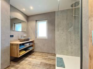 a bathroom with a shower and a sink at Pension Garni Hochmoos in Lermoos +68 photos