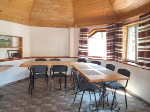 a room with a table and chairs in it at Hollywood in Yaremche