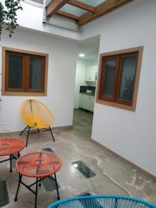 a room with two tables and two chairs at Alojamiento Gofioplaya in Arinaga