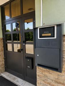 a door of a building with a sign on it at Rezydencja Jagiellońska in Sanok