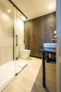 a bathroom with a glass shower and a toilet at A Fontana in Zonza +27 photos