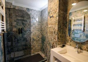 a bathroom with a sink and a shower at 216 Eagle Palace Suite in Istanbul