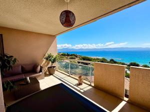 a balcony with a view of the ocean at Casamea - Terrasse Mer, Plage 5min, Barbicaja in Ajaccio