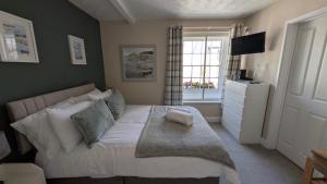 a bedroom with a large bed and a window at The Bugle Inn in Bugle