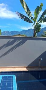 a swimming pool with a view of the mountains at Casa Andreza e Ramon in Paraty
