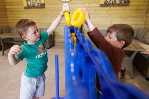 two young boys playing on a play system at Leahys Pod Park in Cork