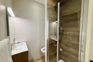 a bathroom with a shower with a sink and a toilet at Casamea - Studio, Terrasse, Clim, Centre hist in Ajaccio