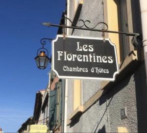 a sign on a building that reads les florentines champions of tubes at Les florentines in Carcassonne