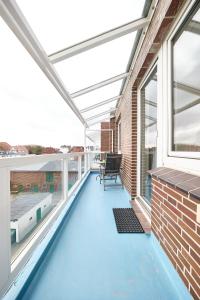a swimming pool on the roof of a house at Haus Schildt, FeWo 6 in Duhnen