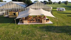 an overhead view of a tent in a field at 'T Groen Beleven in Deinze