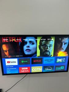 a television screen with several movies on it at T1 centro da cidade cif in Luanda +6 photos