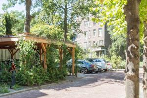 a parking lot with cars parked on the side of a street at Wittenberg by Cove in Amsterdam