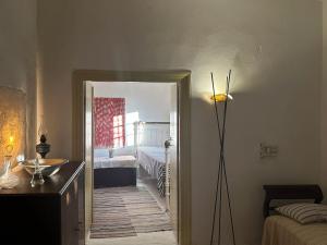 a room with a hallway leading to a bedroom at Mylopotamos House in Milopótamos