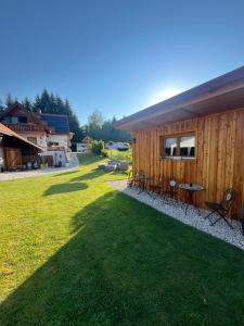a house with a table and chairs in a yard at Privat Glamping Spielberg in Spielberg