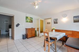 a kitchen and dining room with a table and chairs at Ferienwohnung Bergfranzenhof in Oppenau