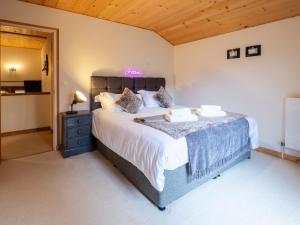 a bedroom with a large bed in a room at Chalet Bolay in Montriond