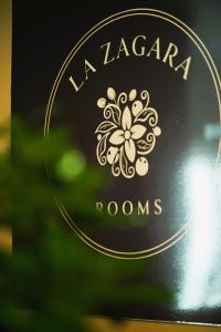 a sign that says la jazaria rooms at La Zagara Rooms - Porto di Milazzo in Milazzo