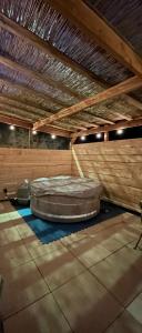 a large room with a large mattress on the floor at Le cocon & spa in Camaret-sur-Aigues