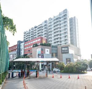a bus stop in a city with tall buildings at Boulevard by Design Hotel Chennai in Chennai